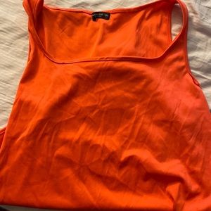 Bright orange body suit and can be worn as a bathing suit